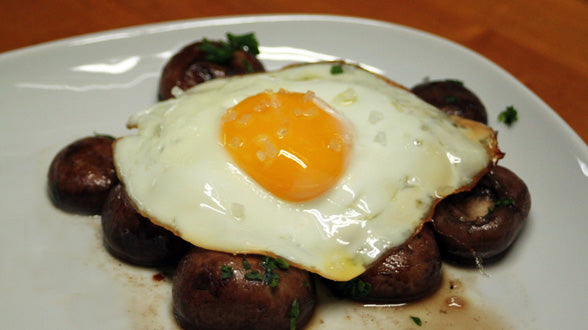 Crimini Mushrooms al Ajillo with an Egg Fried in Olive Oil