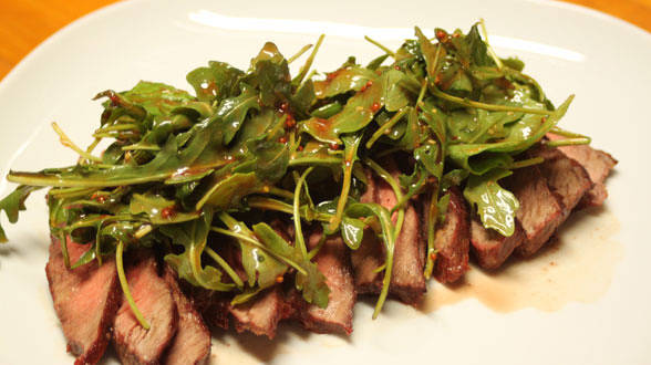 Sliced Steaks with Sweet and Spicy Salad on Top