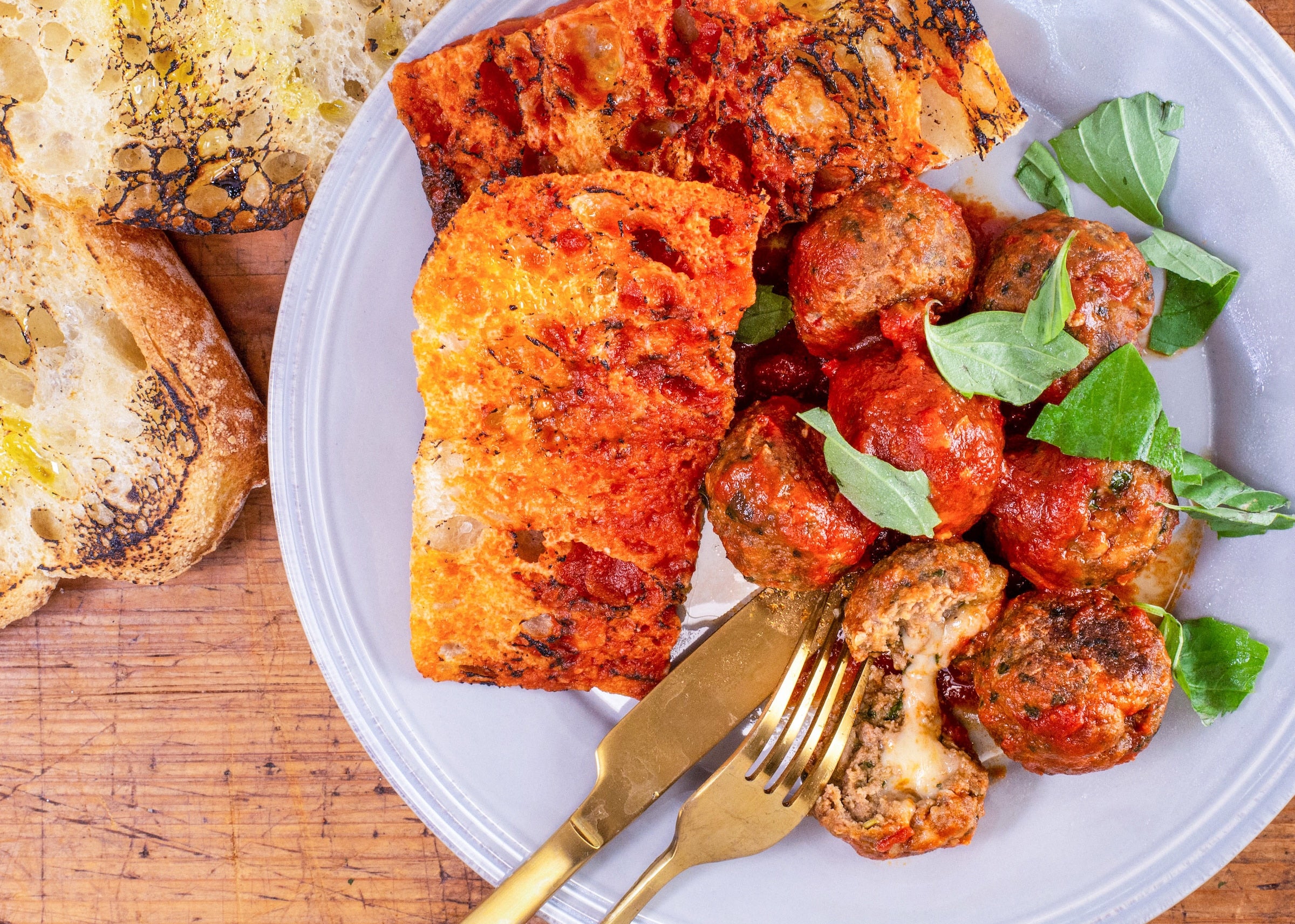 Rachael's Provolone-Stuffed Meatballs With Kale