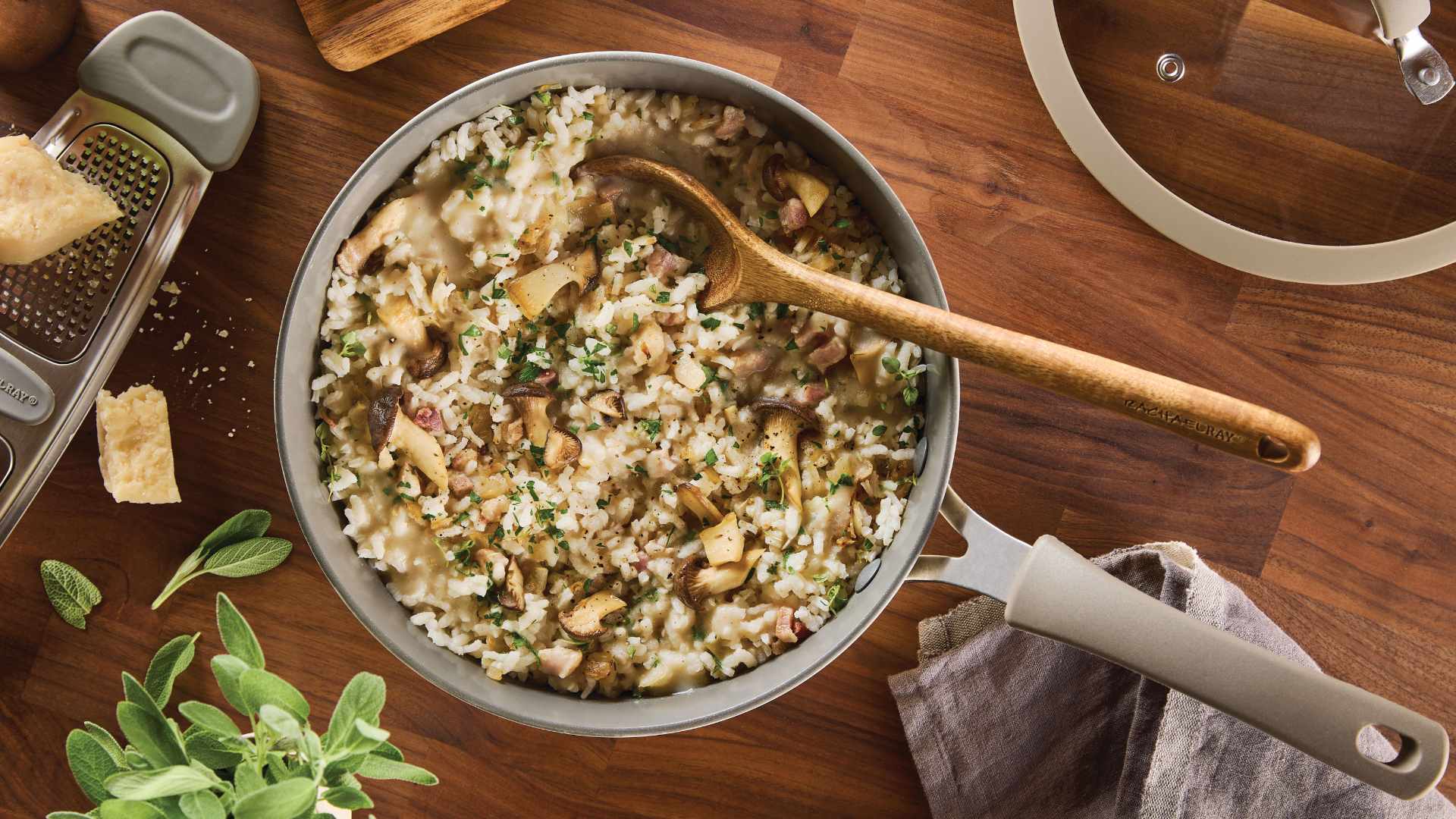 Bacon, Onion and Mushroom Risotto in a Pan with a Wooden Spoon